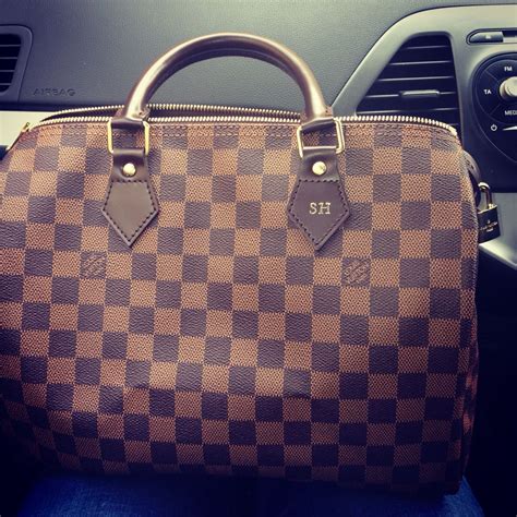 louis vuitton initials on bag.